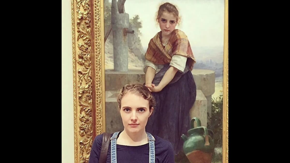 Museum visitor and the girl from The Broken Pitcher painting by French artist William-Adolphe Bouguereau.
